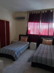 Giường trong phòng chung tại appartement meublé AGDAL 4chambre