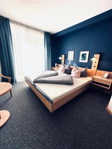 Postel nebo postele na pokoji v ubytování Gästehaus Germania