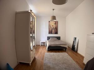 a bedroom with a bed and a large mirror at Gästehaus urucu in Bornheim