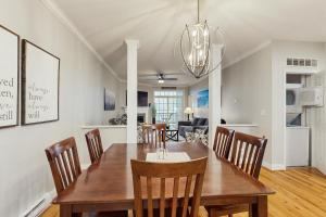 a dining room and living room with a table and chairs at Klonteska B5 in Beech Mountain