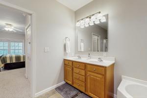 a bathroom with a sink and a mirror at Klonteska B5 in Beech Mountain