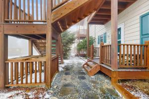 a large deck with a staircase on a house at Klonteska B5 in Beech Mountain