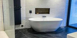 a white tub in a bathroom with a glass shower at Beech Hill Hotel & Spa in Windermere +38 photos