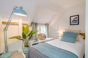 En eller flere senge i et værelse på 3 Bed in Wotton-under-Edge oc-l33488