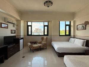 Μια τηλεόραση ή/και κέντρο ψυχαγωγίας στο Ho Feng Private Hotel 電梯自助民宿