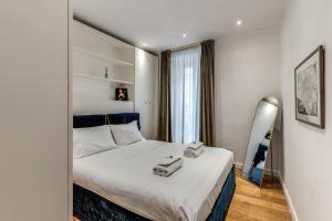 Postel nebo postele na pokoji v ubytování Domus Sabina