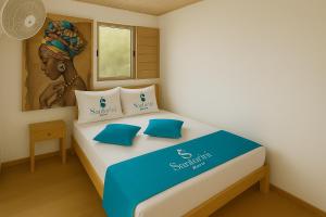 En eller flere senge i et værelse på Santorini Barú