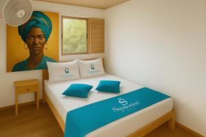 En eller flere senge i et værelse på Santorini Barú