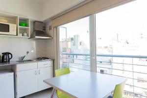 Η κουζίνα ή μικρή κουζίνα στο Le Batiment Apartments