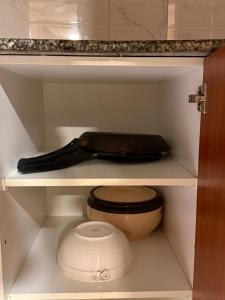 a drawer with a toilet and a bag on it at 2Bed Apartment in Centaurus with City and Margalla views in Islamabad +55 photos