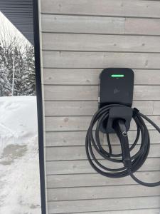 a hose is attached to the side of a house at Zen House 3 - Villas & Spa in Morin Heights