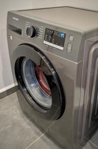 a silver washing machine with its door open at Mimi homes in Tatu City