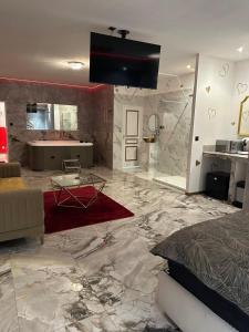 a large living room with a large marble floor at Le Palais Du Khalif in Fabrègues