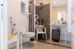 a bathroom with a toilet and a sink at dimora Spine Bianche in Matera