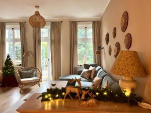 Posezení v ubytování Agapella Apartamenty- Sopot Cottage Ogród 400m od plaży 6 dorosłych i dzieci