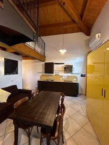 a living room with a wooden table and a couch at Agriturismo La Boschina in Crema +7 photos