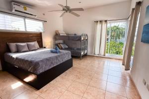 a bedroom with a bed and a ceiling fan at Casa Cielo in La Libertad +52 photos