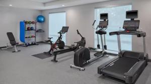 a gym with several exercise equipment in a room at Home 2 Suites by Hilton Frankenmuth in Frankenmuth +5 photos