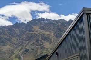 a view of a mountain range from a building at Te Maunga Retreat | Views, Space & Near Ski Fields in Frankton