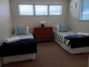 Giường trong phòng chung tại Tymeout