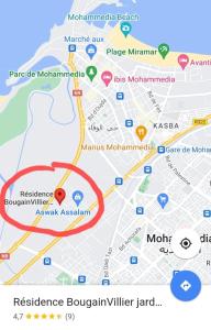 a map with a red circle at Chez Rime Cosy apartment with pool view in Mohammedia