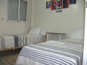 Giường trong phòng chung tại Chez Rime Cosy apartment with pool view +35 ảnh