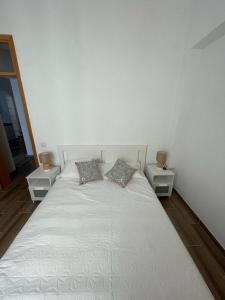 Giường trong phòng chung tại Casa do largo +6 ảnh