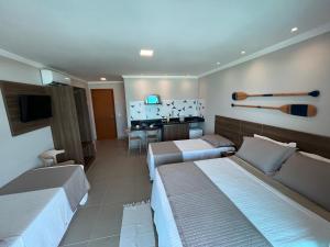 TV a/nebo společenská místnost v ubytování Éolos Loft's - Cabo Frio