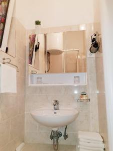 Et badeværelse på Apartments Goge + 27 billeder