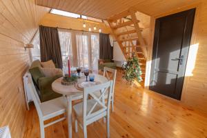 a dining room and living room in a tiny house at Kamara in Sioni +29 photos