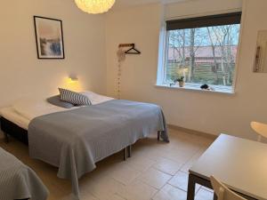 Postel nebo postele na pokoji v ubytování Guesthouse Hune