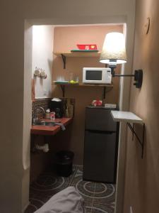 Kuchyň nebo kuchyňský kout v ubytování Mini Vacation in Chelem