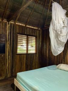 Postel nebo postele na pokoji v ubytování Nirvana Maya