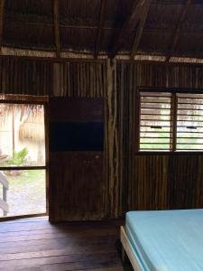 Postel nebo postele na pokoji v ubytování Nirvana Maya