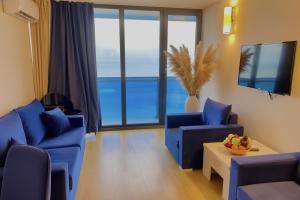 TV a/nebo společenská místnost v ubytování orbi city apartments