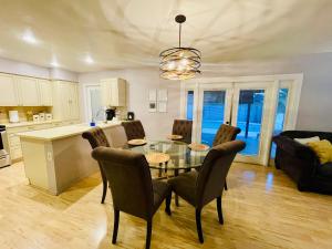 a kitchen and living room with a table and chairs at Tempe Escape with Heated Pool, Billiards & Firepit Fun in Tempe