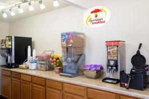 a counter with some food on top of it at Super 8 by Wyndham Marietta in Marietta