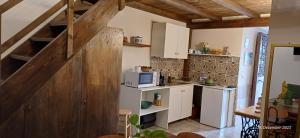 a small kitchen with a counter and a microwave at La Cittadella in Bisceglie