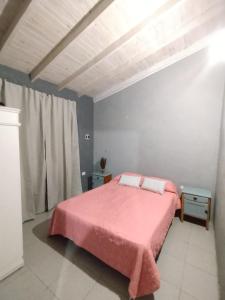 En eller flere senge i et værelse på Casa de mar