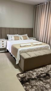 En eller flere senge i et værelse på Refúgio dos Sonhos Conforto e Tranquilidade