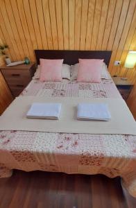 a bedroom with a bed with two pillows on it at Casa en Puerto Montt in Puerto Montt +4 photos