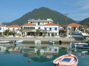 a group of boats are docked in a harbor at Melistas Rooms in Marathias