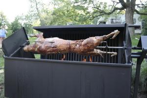 a piece of meat is cooking on a grill at Penzion Javořice in Telč