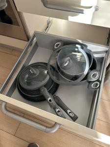 a drawer with several different utensils in it at Larocca Tourist Home 6 Bassano in Bassano del Grappa