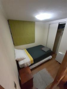 En eller flere senge i et værelse på Departamento Viña centro