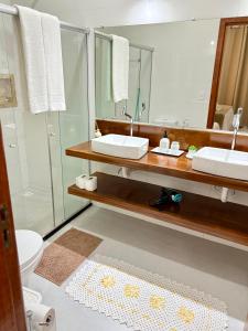 Et badeværelse på Casa Charme Conforto Arraial Dajuda Piscina privativa