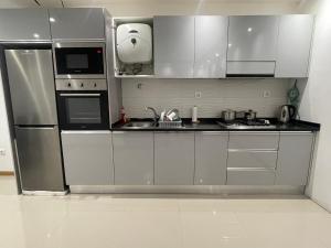 Kuchyň nebo kuchyňský kout v ubytování Casa Mendes- Quarto individual