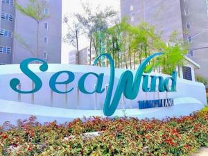 a sign for sea wind in front of buildings at MD Suite by Seawind in Davao City