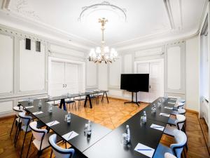 a large meeting room with a large table and chairs at TRIBE Riga City Centre in Rīga