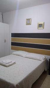 En eller flere senge i et værelse på Apart Balcarce